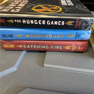 The Hunger Games Trilogy by Collins - Black, Blue, and Red